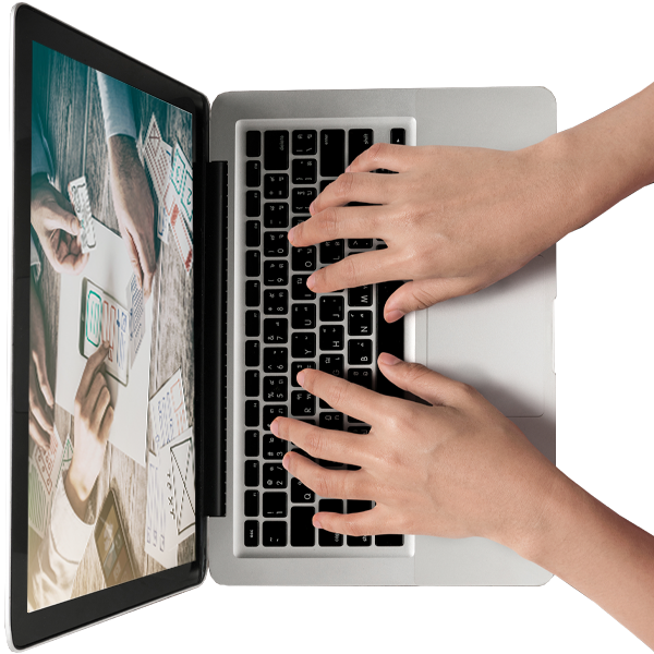 hands typing on a laptop